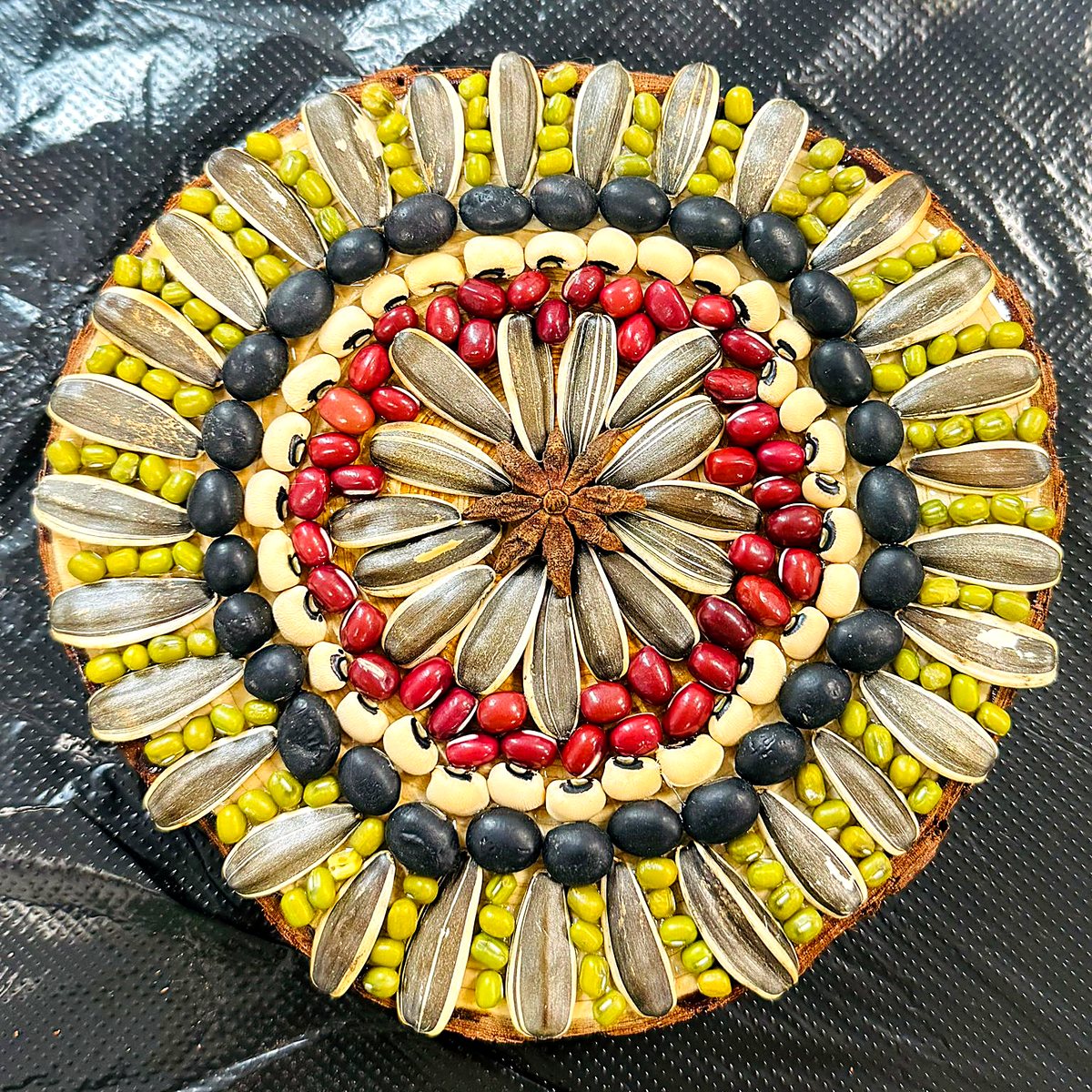 A finished seed mandala made by a learner